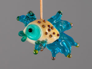 Turquoise fish glass bead