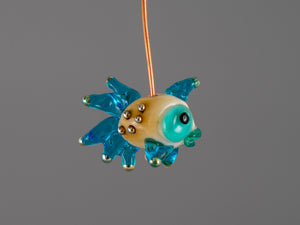 Turquoise fish glass bead