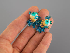 Turquoise fish glass bead