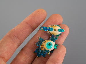 Turquoise fish glass bead